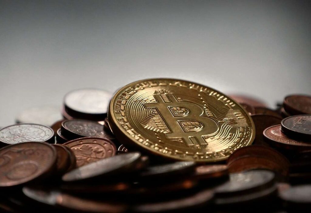 moneta con Bitcoin