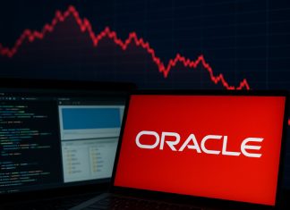 Oracle su un desktop e grafico di borsa