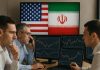 trader che analizzano e sullo sfondo bandiera Usa e Iran