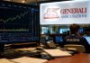 Azioni Generali: trimestrale assist per ritorno sui massimi annui? trader in sala operativa e insegna Generali