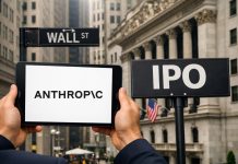 sfondo Wall Street e logo Anthropic su tablet