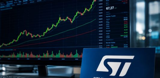 grafico borsa e desktop con insegna STM