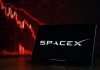 grafico in ribasso e logo SpaceX su tablet