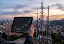 Perchè le azioni Inwit salgono così tanto? tablet con grafico a candele e sullo sfondo antenna Tlc